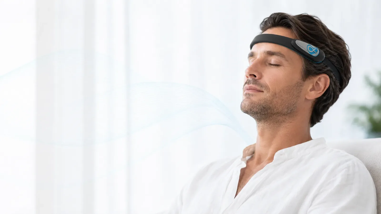 Relaxed man with his eyes closed, wearing the NEUROS Focus headband